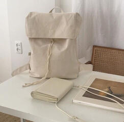 cream aesthetic backpack and books