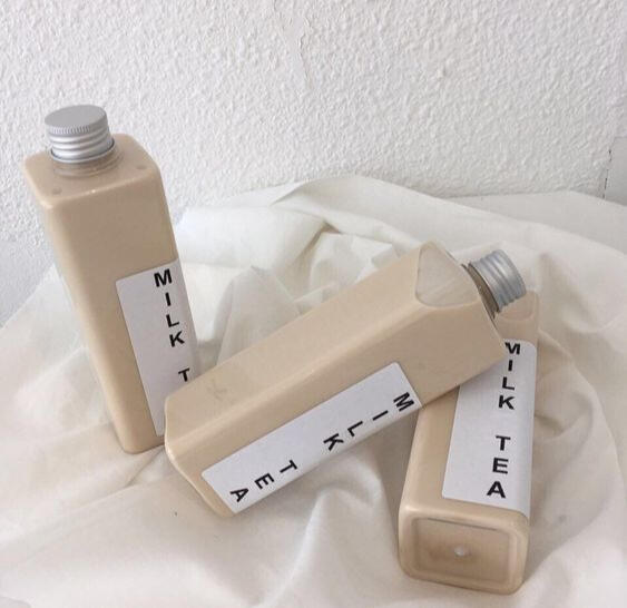 cream aesthetic milk tea bottles